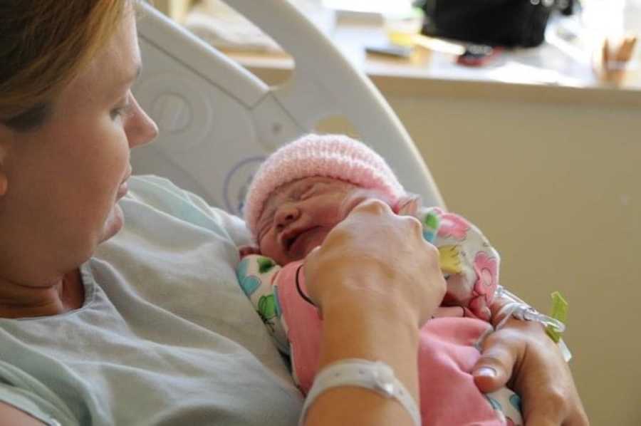 mom holding her newborn girl