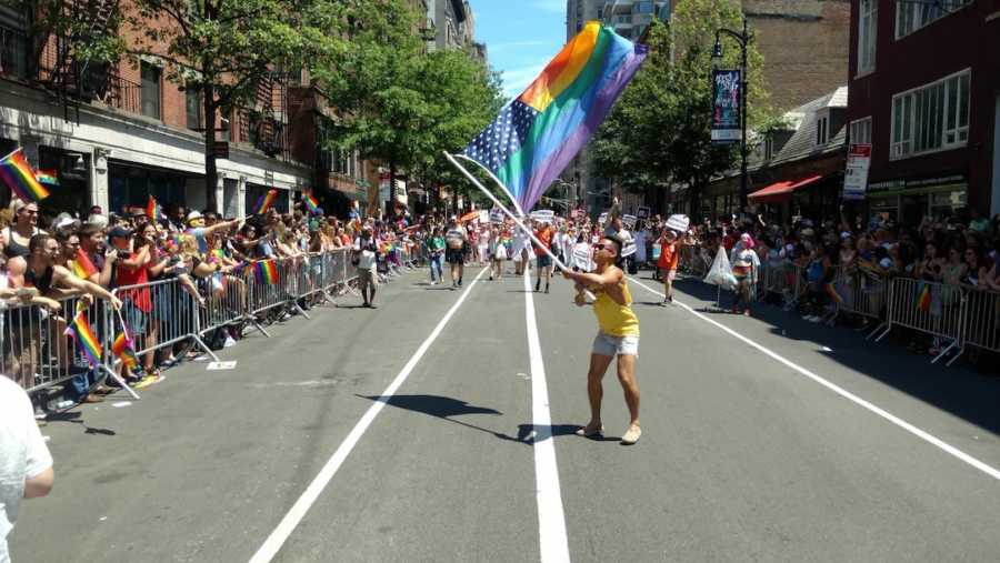 man holding pride flag