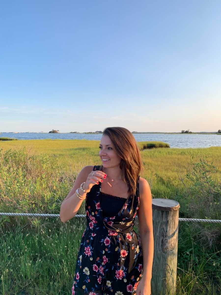 Woman smiling by lake