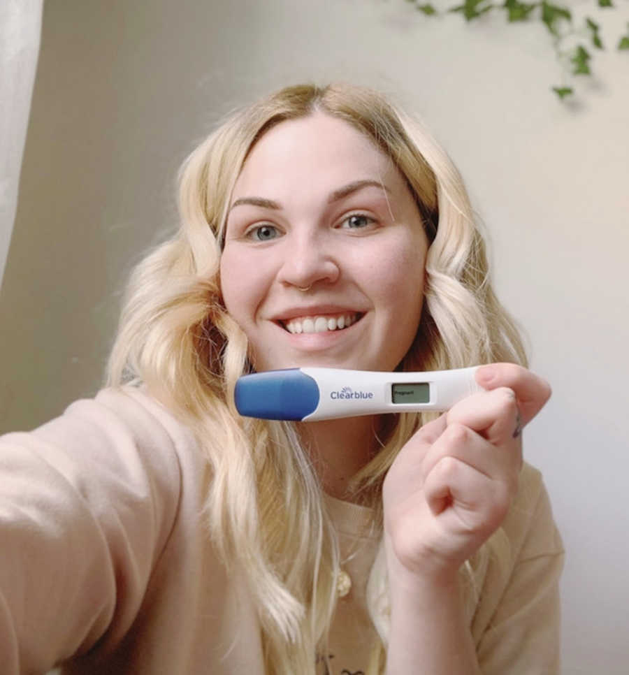 mom with positive pregnancy test