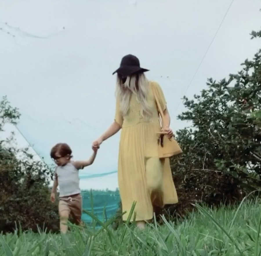 mom and son walking