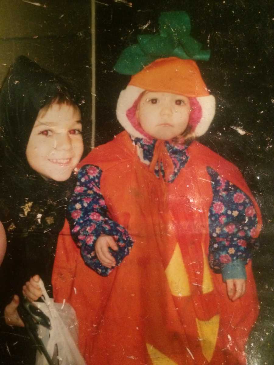 kid in pumpkin costume