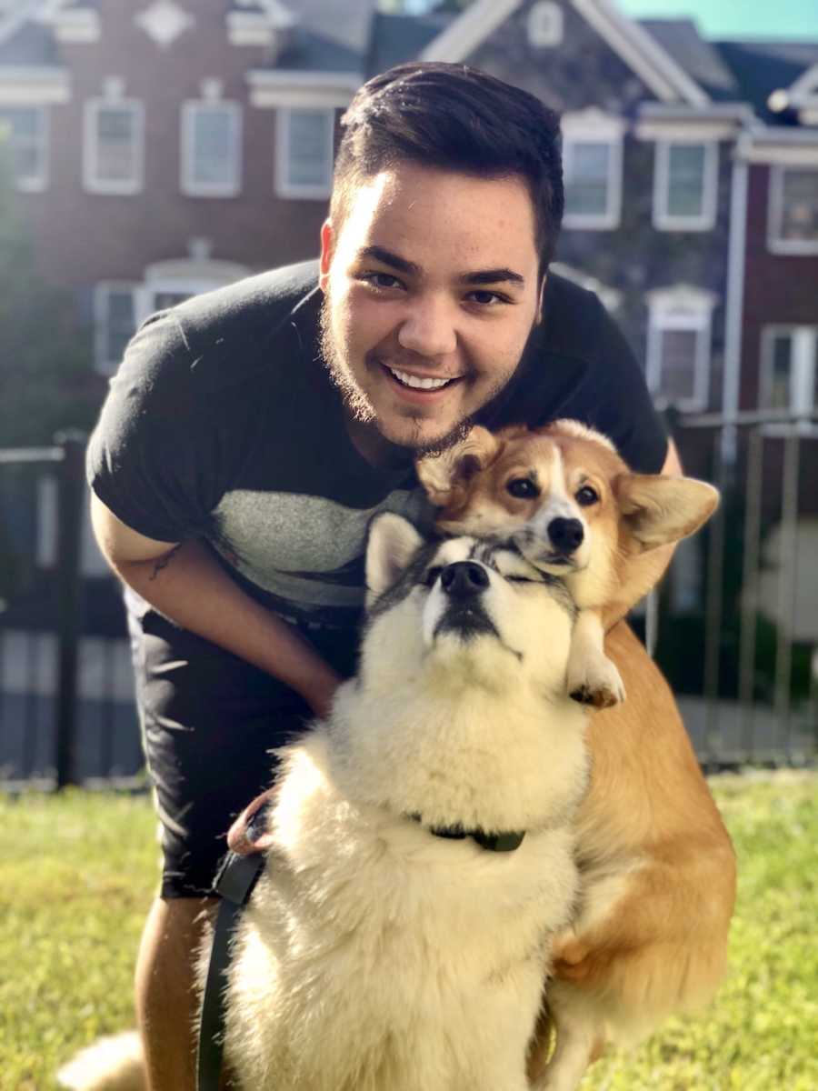 man with his dogs, smiling