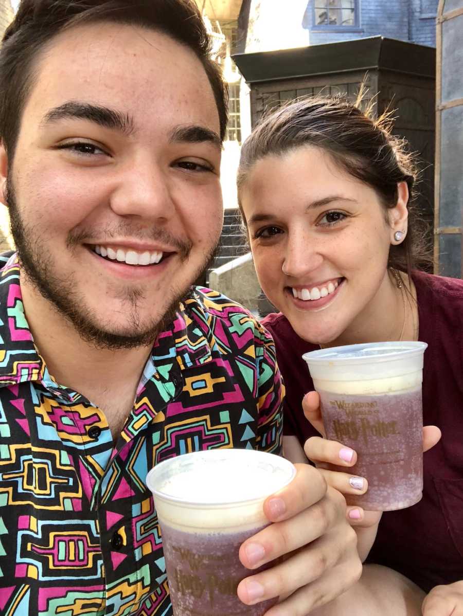 couple at Universal with butterbeer drinks