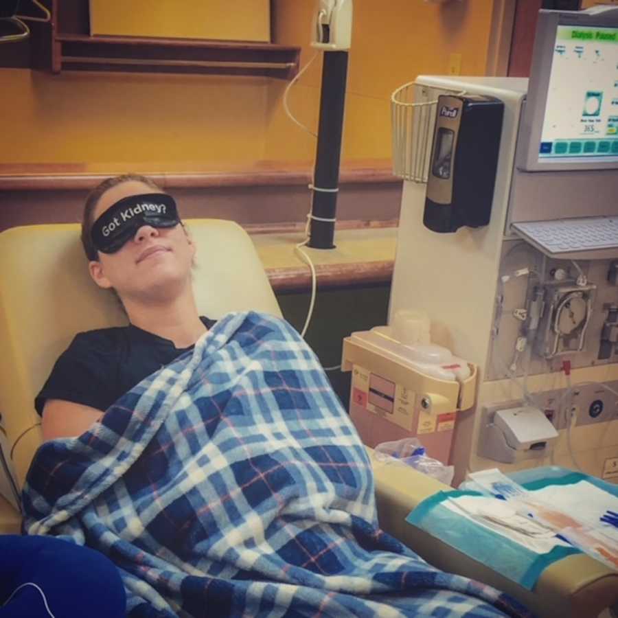 woman in "got kidney" sleep mask in hospital bed