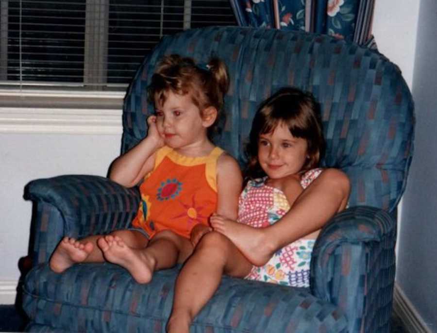 two young sisters on a chair