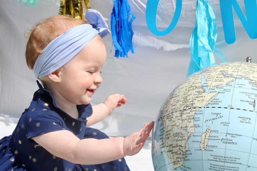 Baby with globe