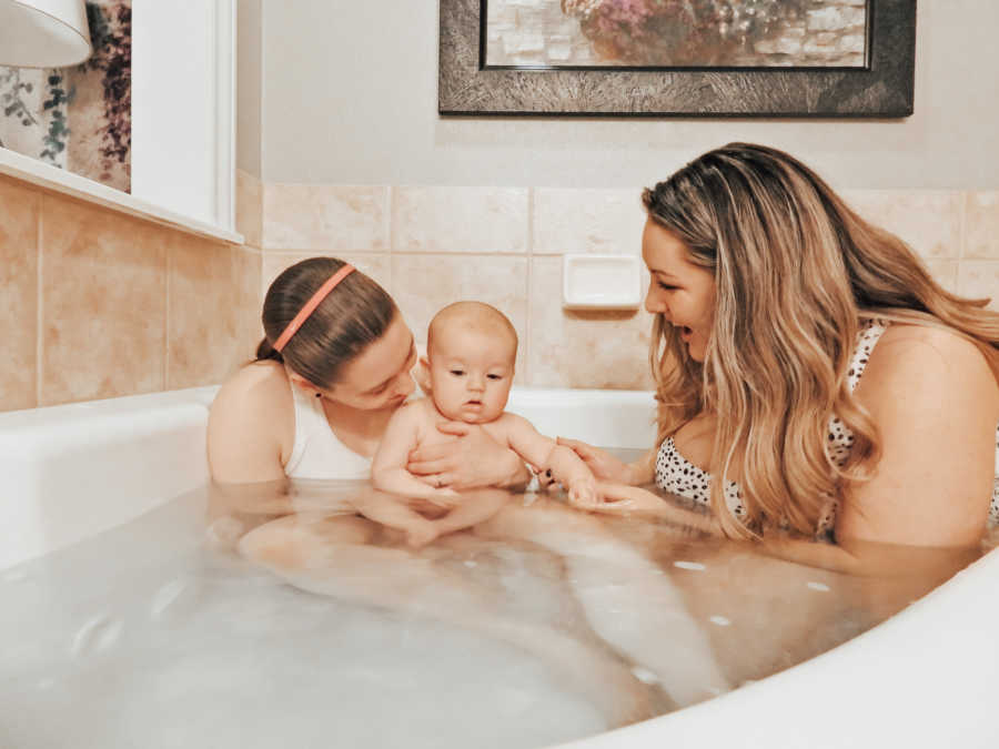 moms in bathtub with their son