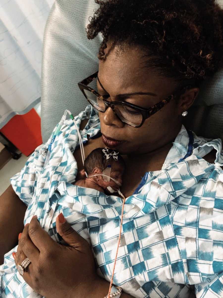 Woman holds her preemie NICU warrior after almost dying during labor