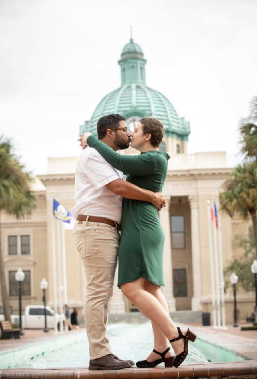 Husband and wife kissing