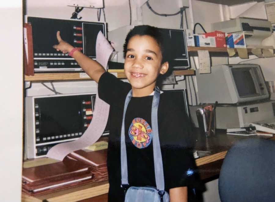 Young boy pointing to computer screen