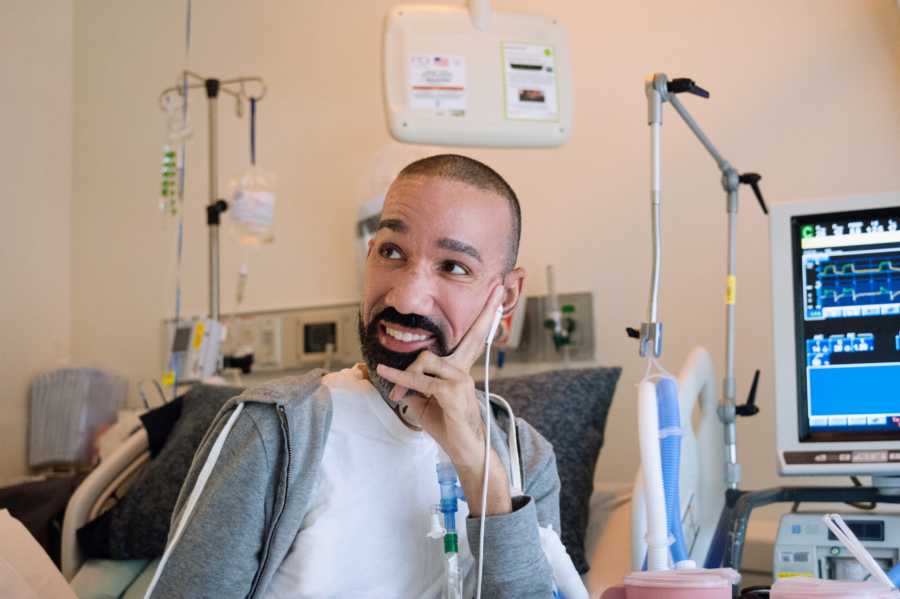 Man resting head on hand in hospital 