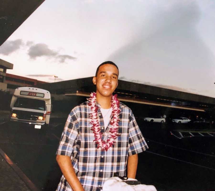 Man at airport in Hawaii wearing lei