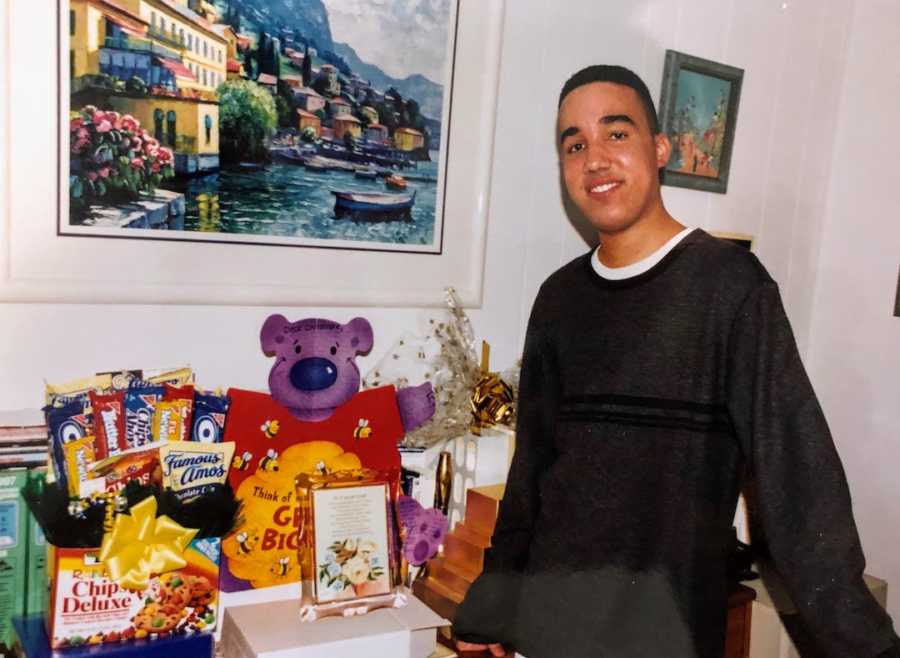 Young man posing with snacks and teddy bear