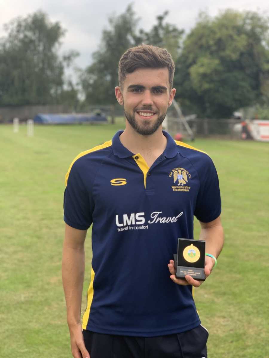 Man posing with award