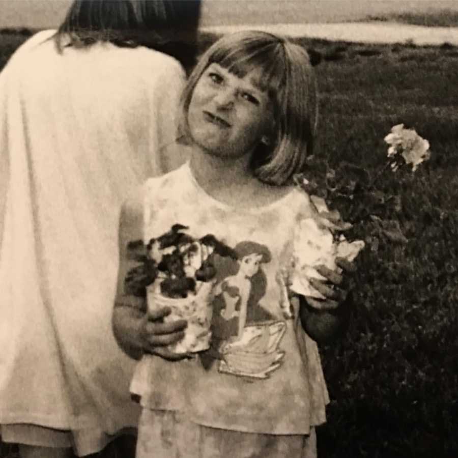 young person unhappy in an Ariel "Little Mermaid" shirt