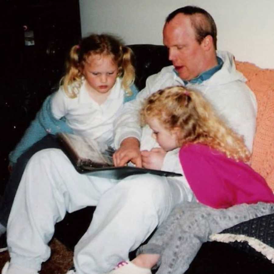 two young girls with their dad