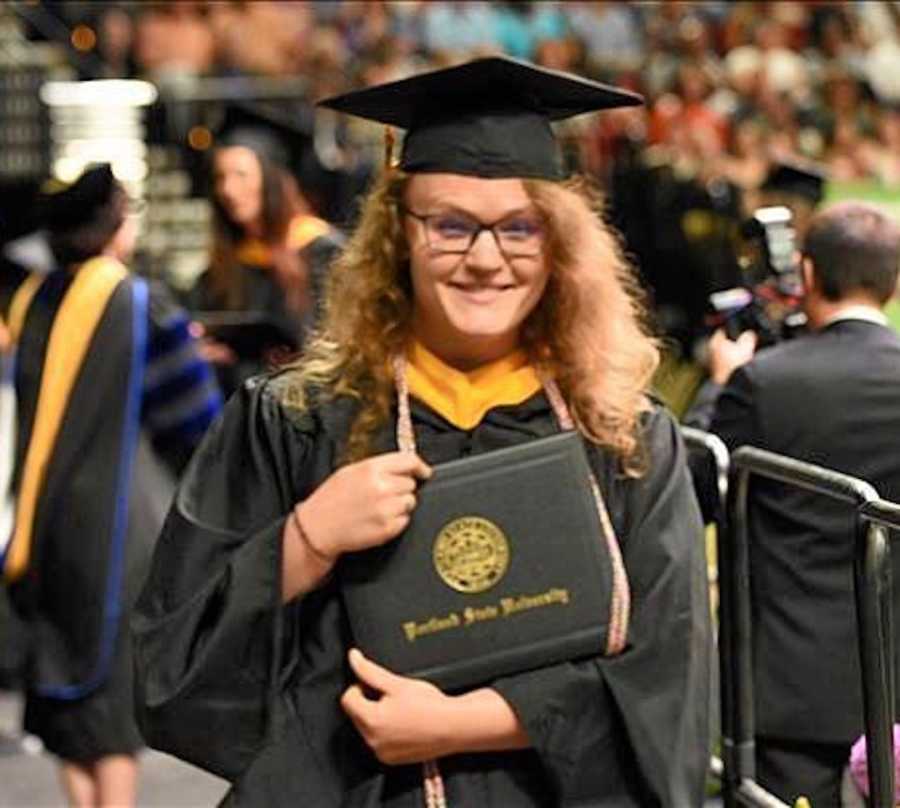 woman graduating college- cap and gown