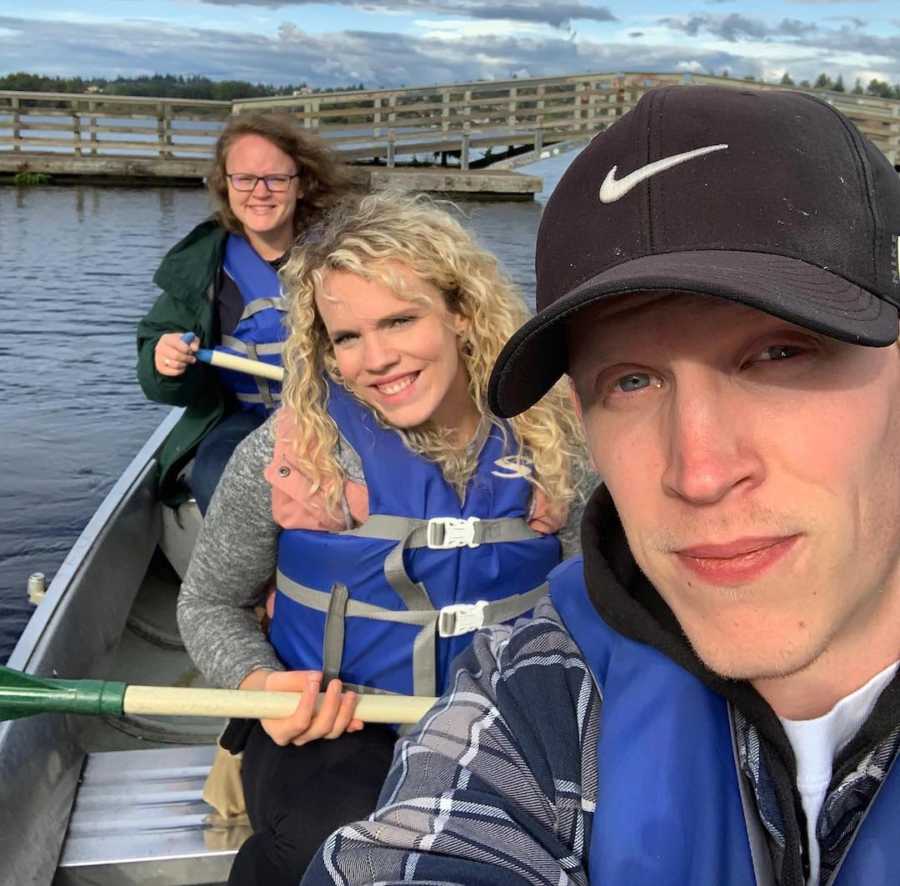 woman with two siblings outside on boat