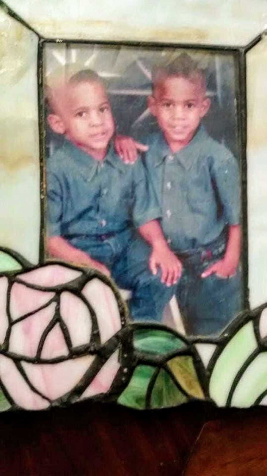 Young twins pose in matching outfits