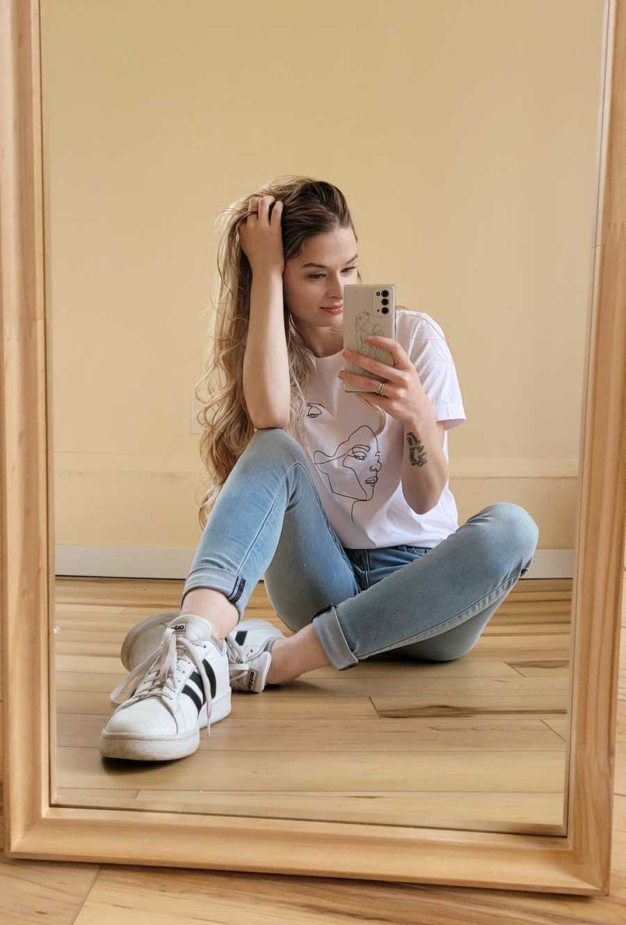 girl taking mirror selfie