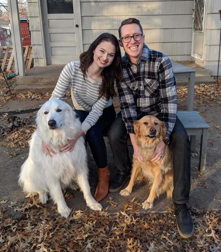 couple with two dogs