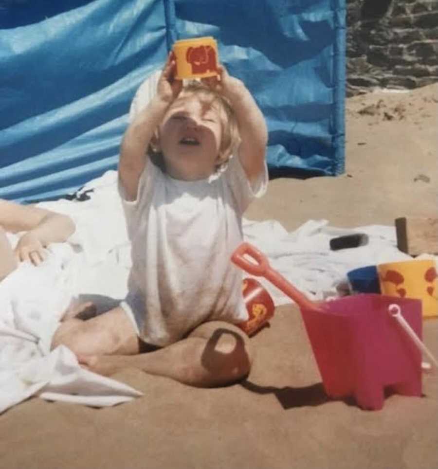 young girl playing in the sand