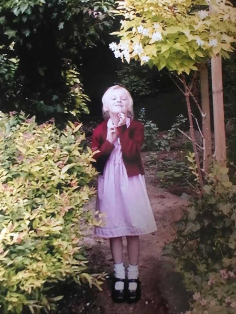 girl stimming in the yard