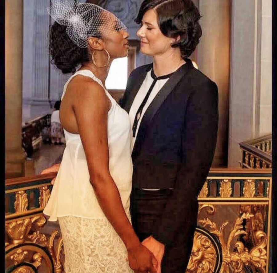 Lesbian couple kissing at their wedding