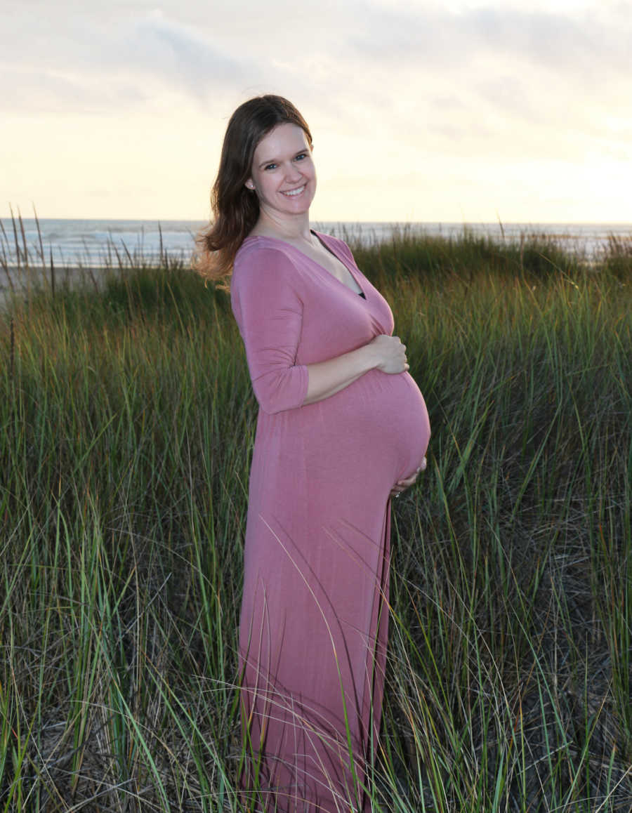 pregnant woman in purple dress