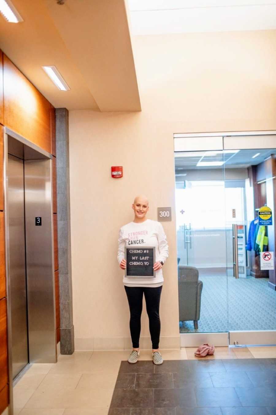 Woman with triple negative breast cancer celebrates her last chemo treatment