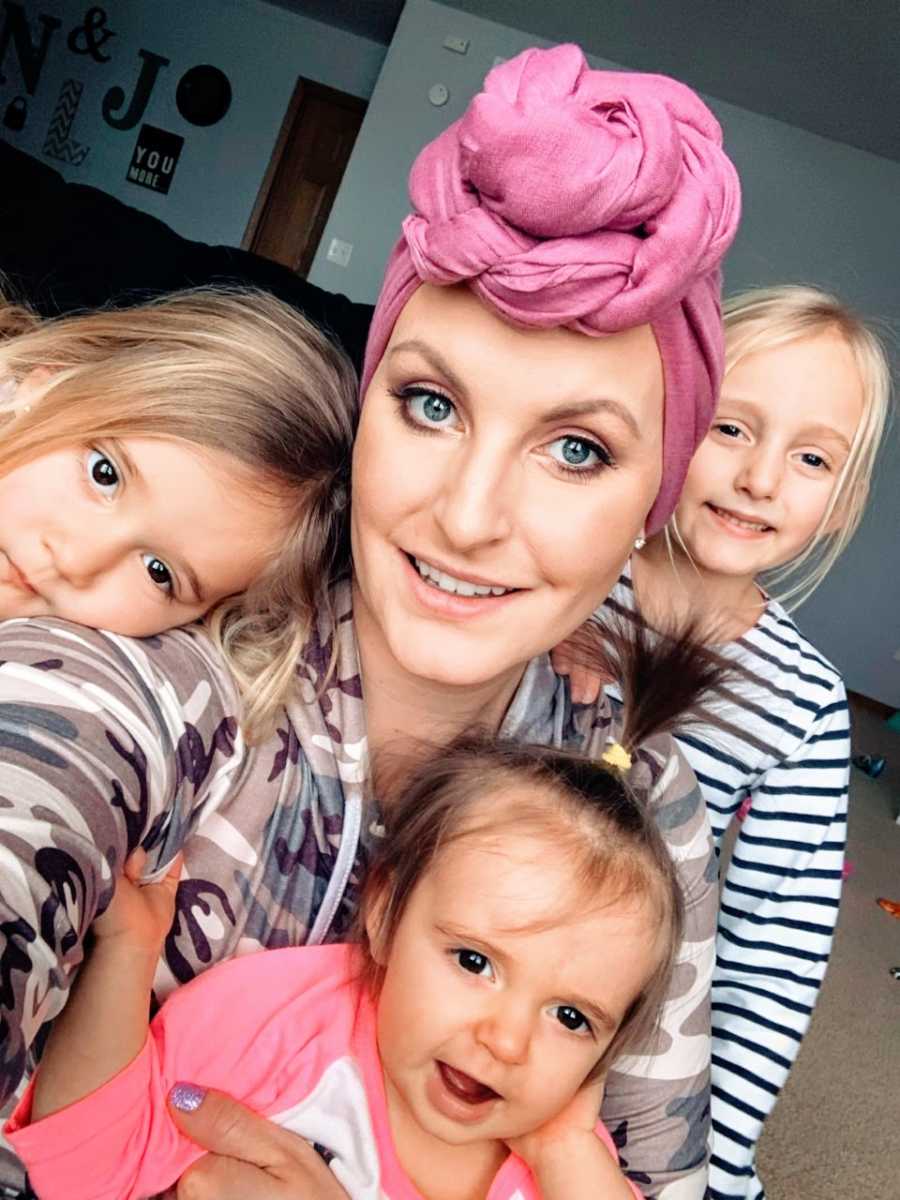 Mom recovering from triple negative breast cancer takes a beautiful selfie with her three daughters