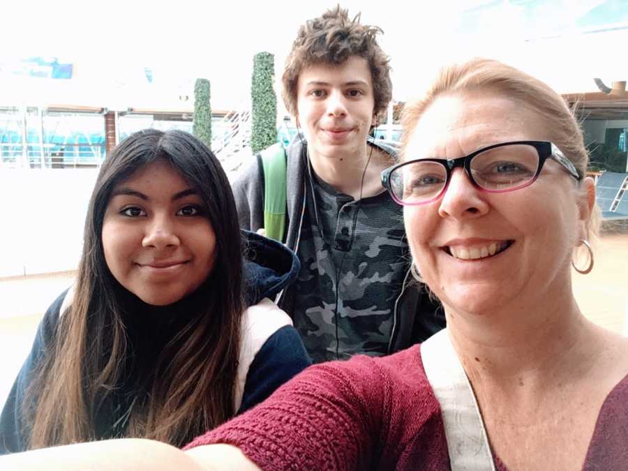 Woman takes selfie with her two adopted children