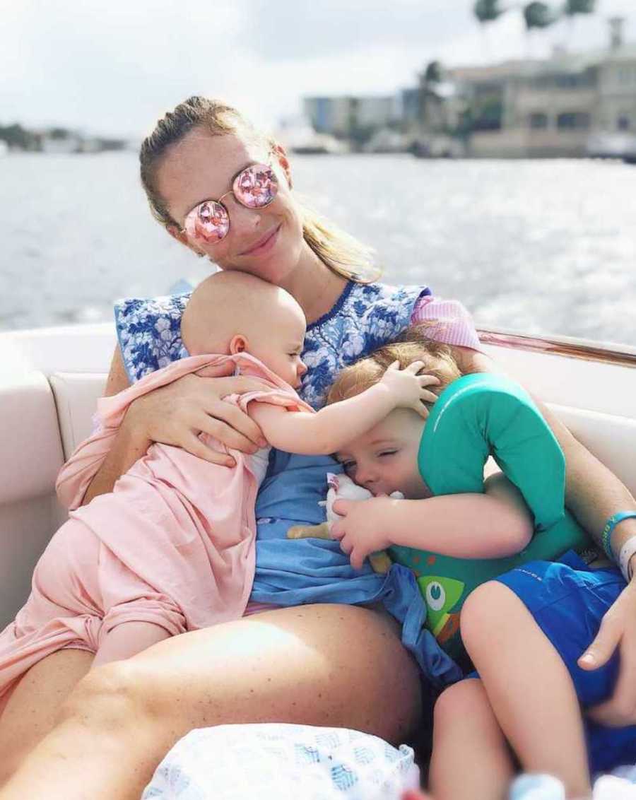 mom on boat with two children