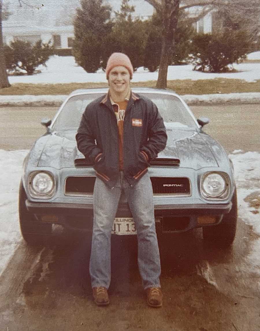 Dad posing on car