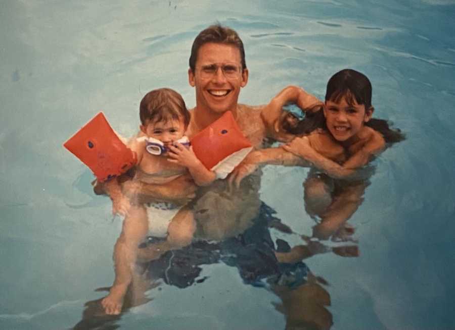 Dad with daughters in pool