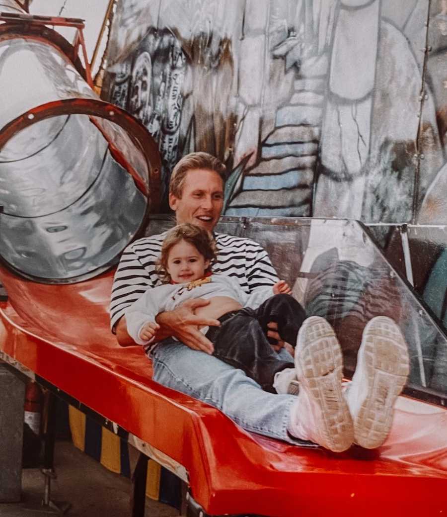 Dad and daughter on slide