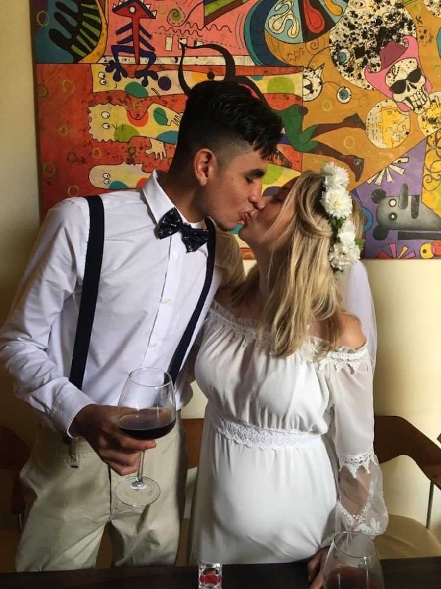 Couple kissing at wedding