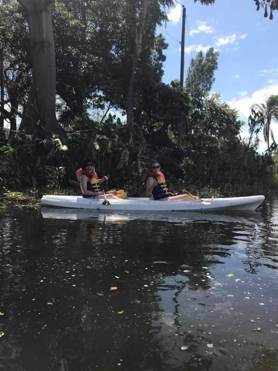 Friends kayaking on vacation