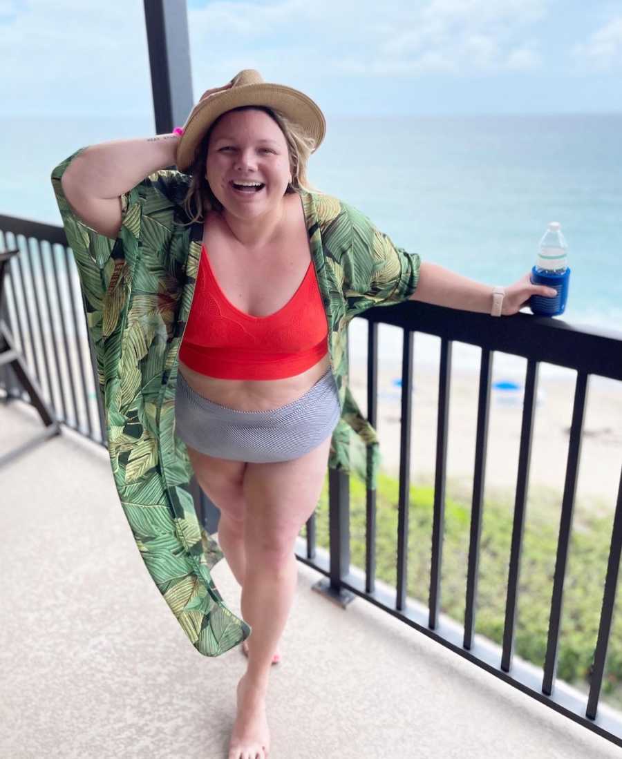 young woman laughing in bathing suit