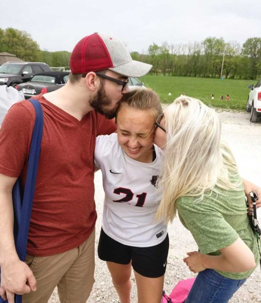 People kissing sister on cheek