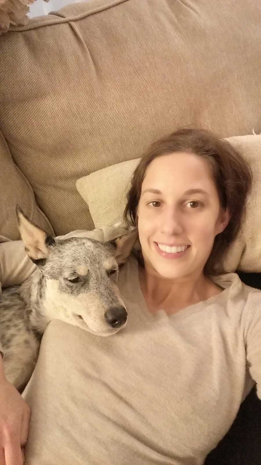 woman on the couch with her dog