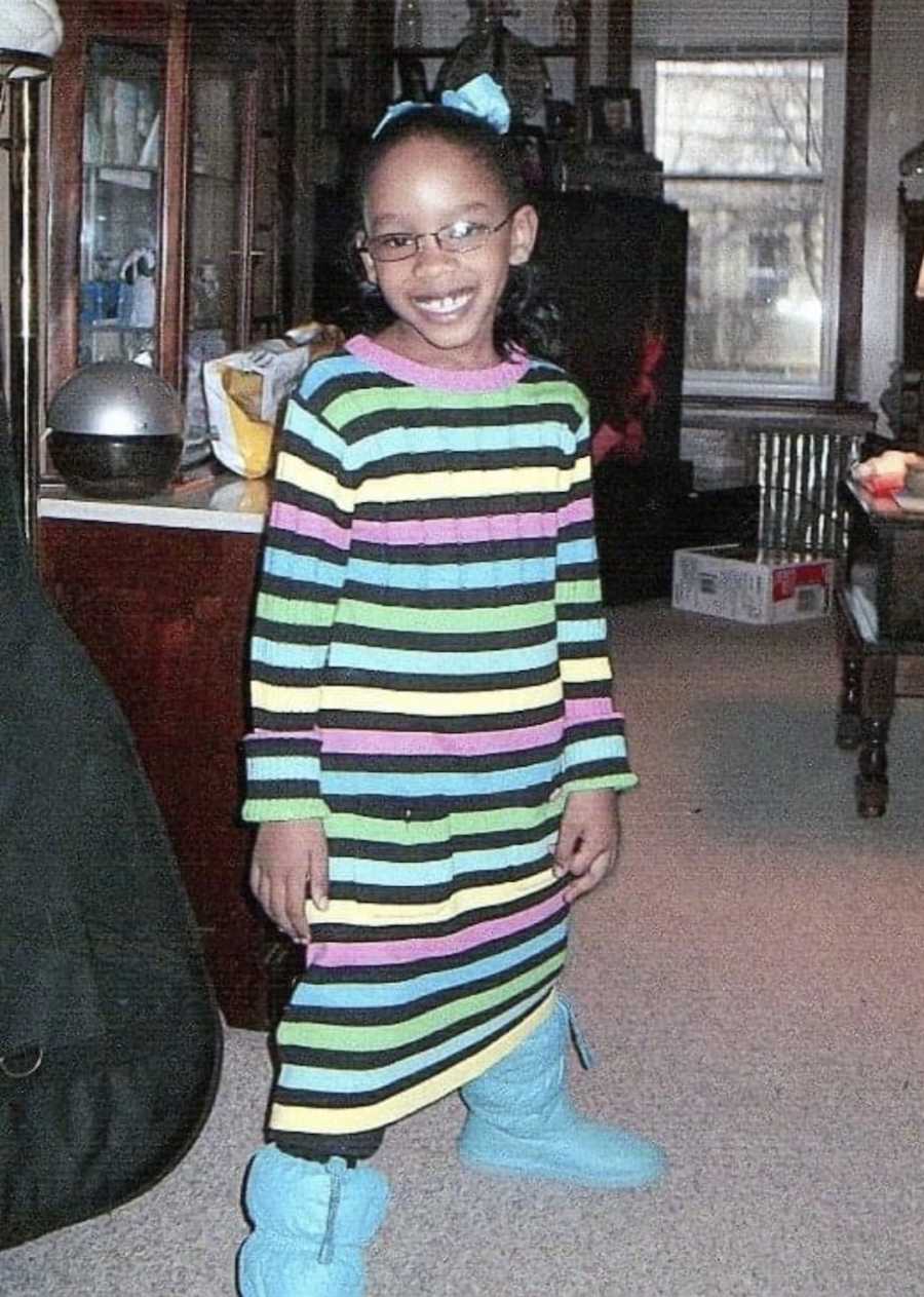 child in striped dress