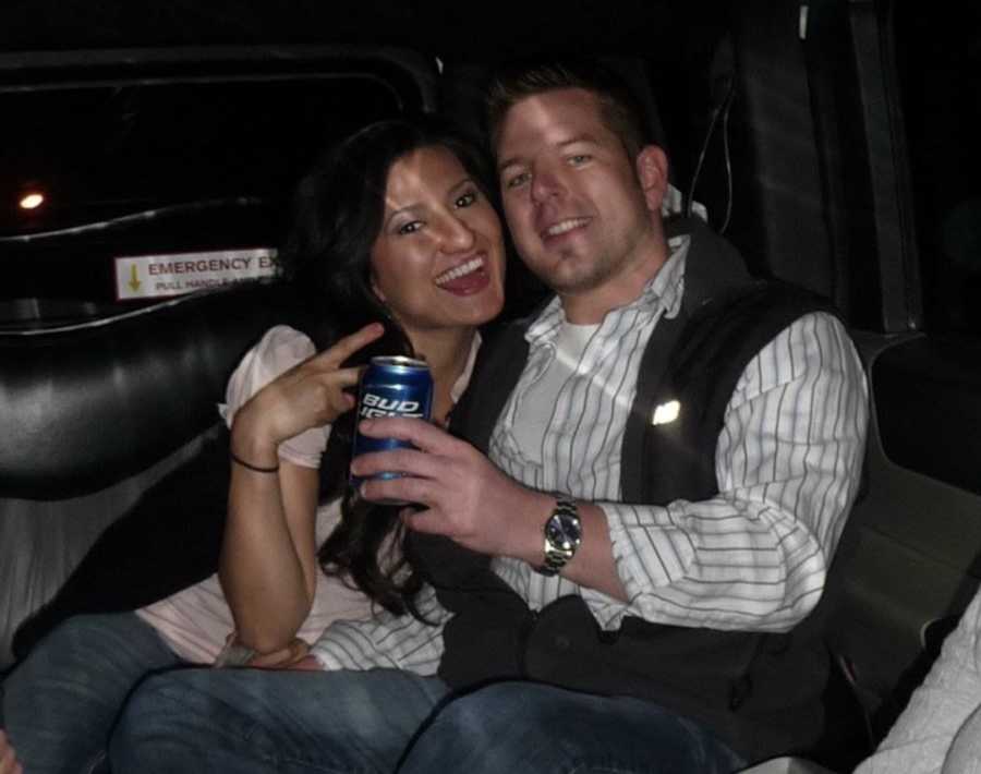 husband and wife in taxi, drinking