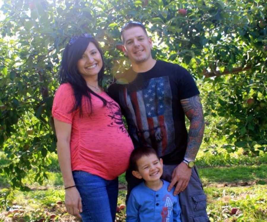 pregnant woman with husband and kid