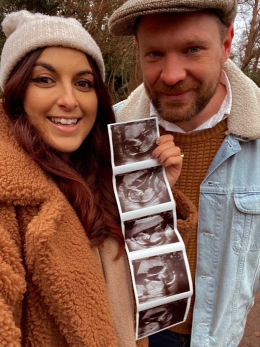 Parents holding sonogram photos