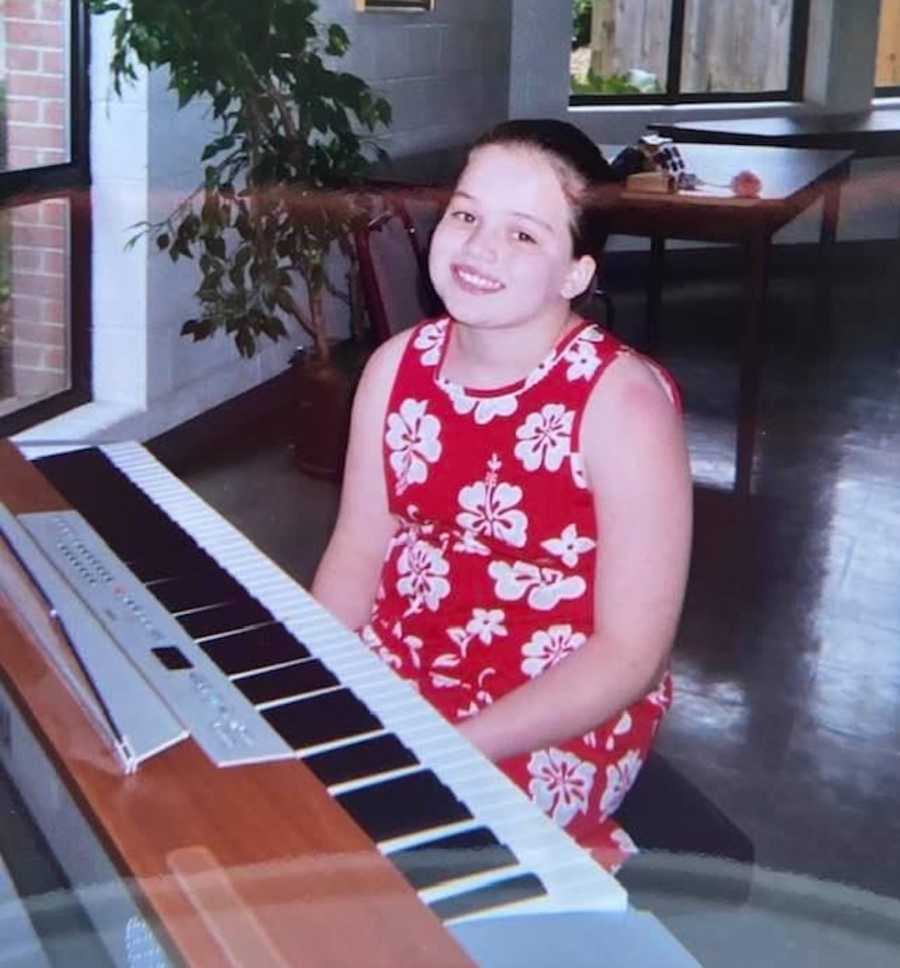 young girl playing piano