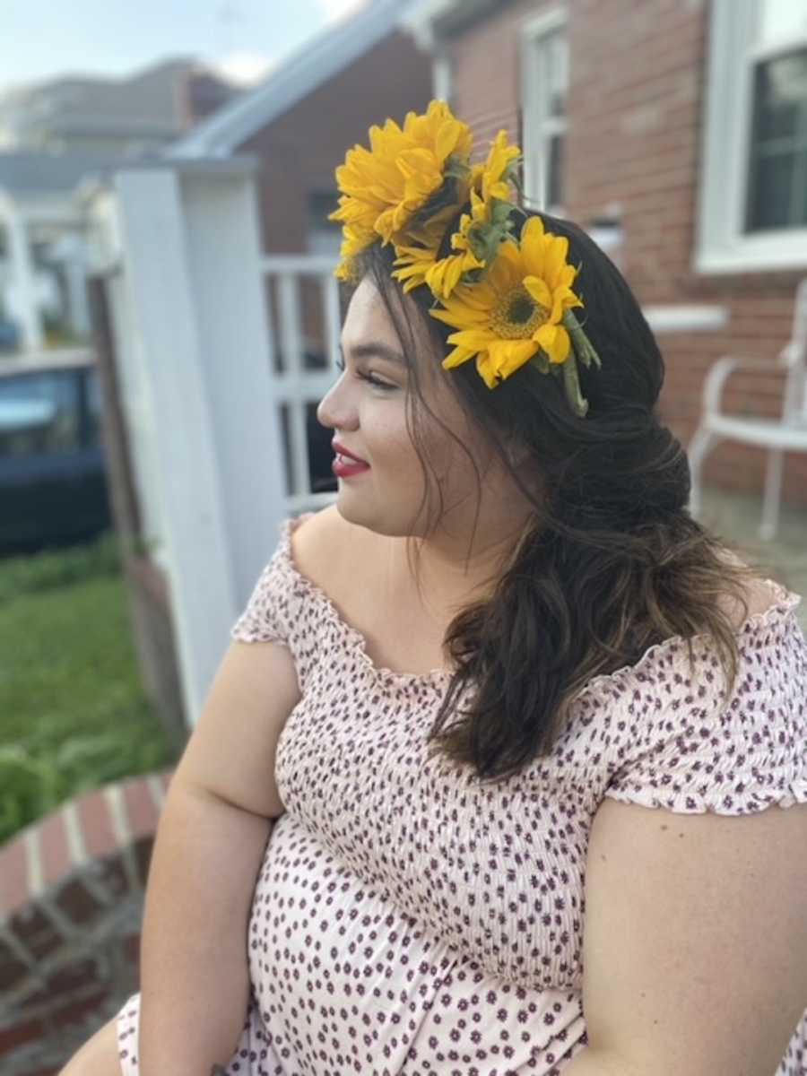 girl in flower crown looking to the side