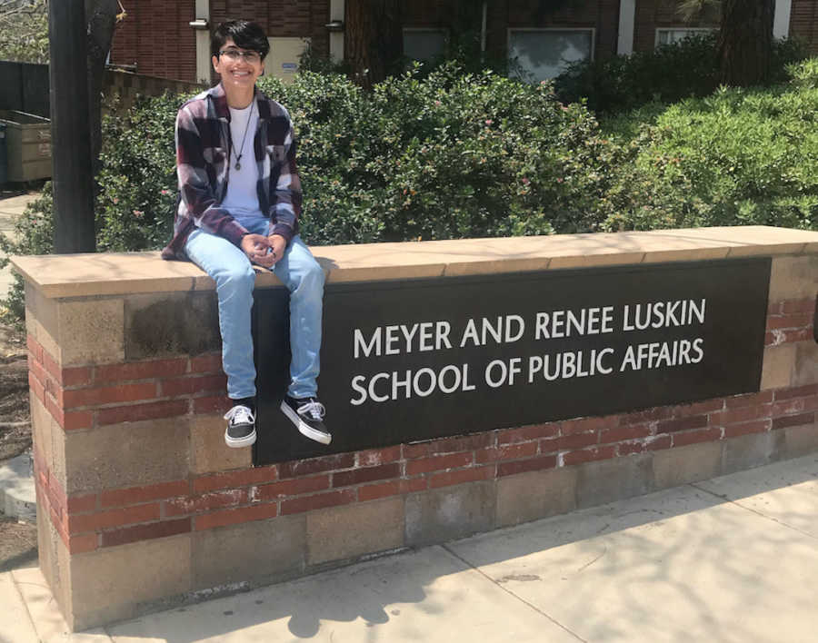 person in front of a school