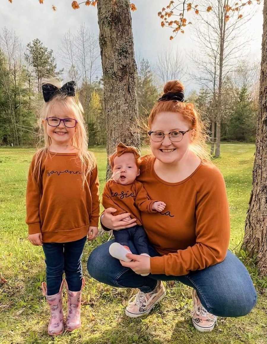 Mom posing with daughters